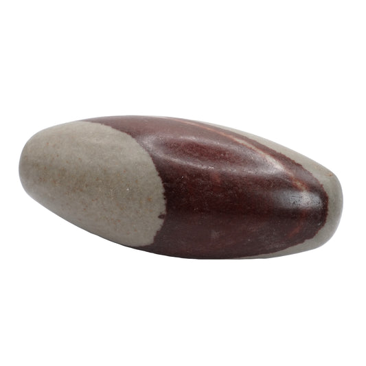 Pierre roulée en Shiva lingam de qualité A provenant d’Inde, et mesurent entre 10 et 13 cm de longueur. Cette pierre de Shiva Lingam est de couleur marron foncé et beige.